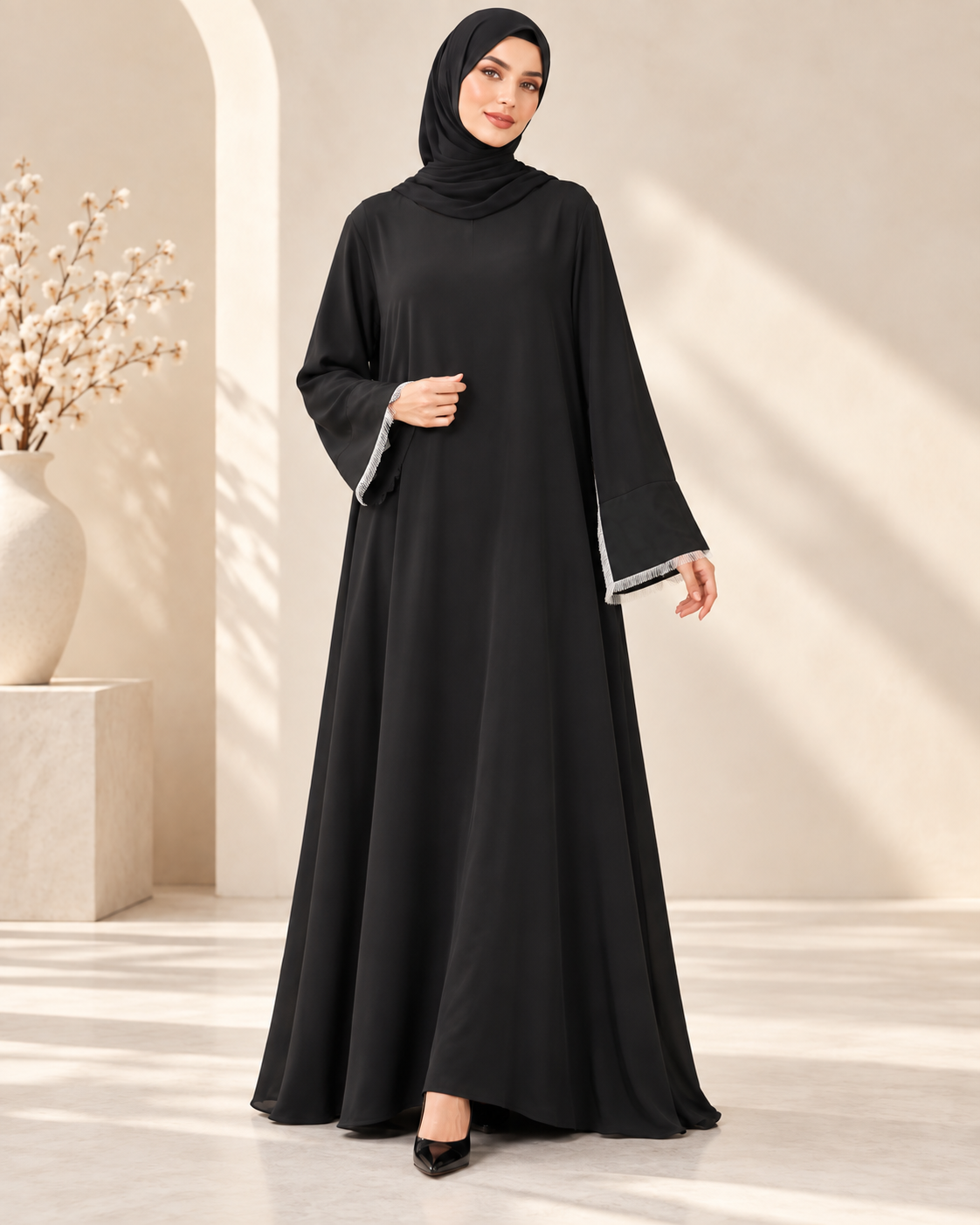 Model wearing minimal black abaya